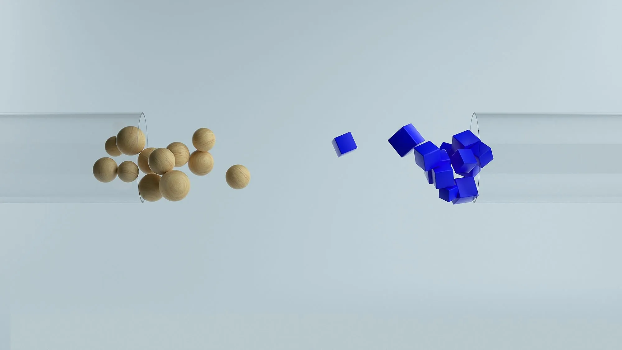 Wooden spheres spilling out of a clear tube on the left and blue cubes tumbling into a tube on the right, against a pale grey background.